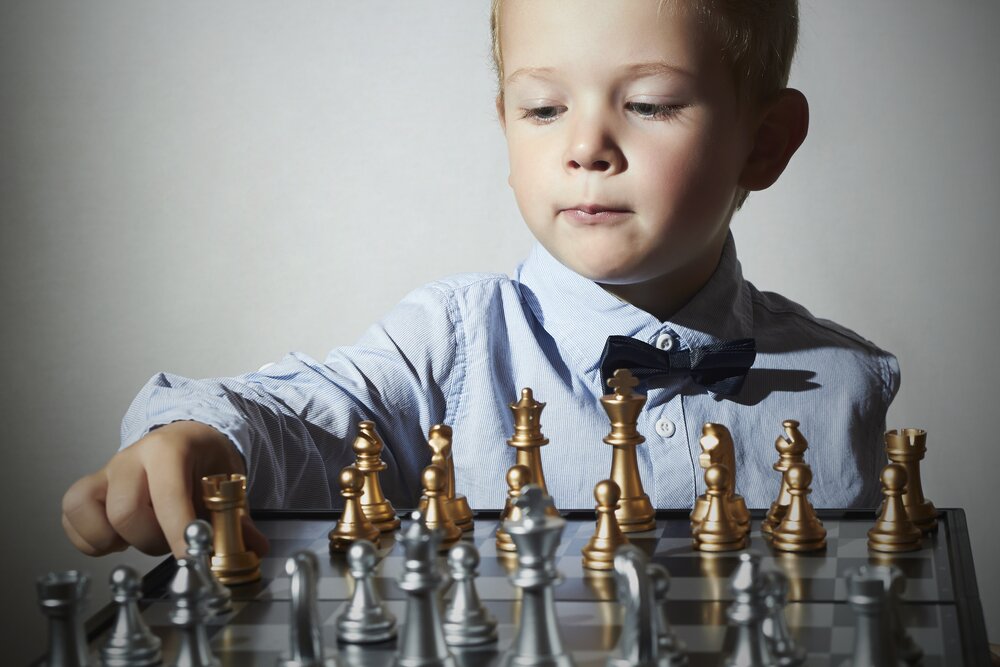 smart kid playing chess